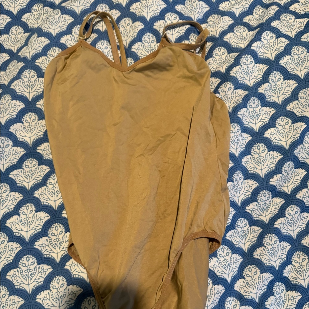 Tan leotard which is worn under costumes, brand Bloch, large child